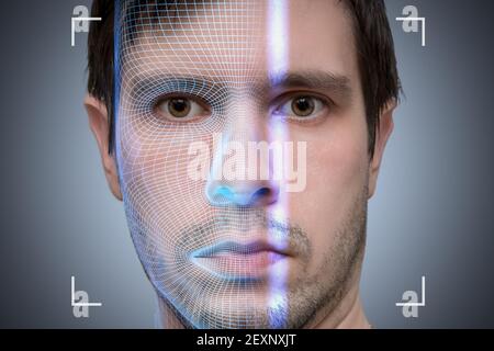 Biometric scanner is scanning face of young man. Artificial intelligence concept. Stock Photo