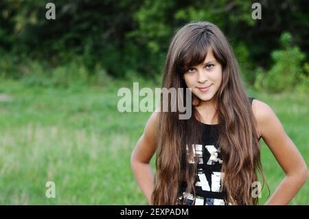 Brunette teen girl on nature Stock Photo