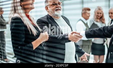 close up. two businessmen shaking hands in the office lobby Stock Photo