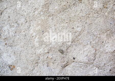 Vintage background texture concrete wall colored plaster. Stucco wall texture. Dense grain texture made with tiny stones, earthy colors, on a wall bac Stock Photo