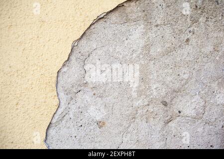 Background texture concrete wall colored plaster. Stucco wall texture. Dense grain texture made with tiny stones, earthy colors, on a wall background. Stock Photo