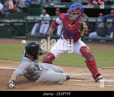 Seattle Mariners' Dustin Ackley safely dives back to first base after a  pick-off attempt in the fifth inning of a baseball game against the Detroit  Tigers, Sunday, June 1, 2014, in Seattle. (