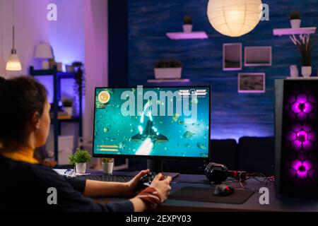 Pro woman egame cyber playing online with virtual reality headset and  wireless controller. Virtual space shooter championship in cyberspace,  esports player performing on pc during gaming tournament Stock Photo - Alamy