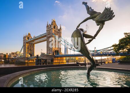 June 29, 2018: Girl with Dolphin fountain on the north bank of the Thames near Tower Bridge in London, England, UK. It was  made in 1973 by the Englis Stock Photo