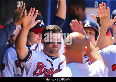 The Atlanta Braves' Chipper Jones is congratulated by teammate Freddie  Freeman (5) after his solo home run in the second inning against the Los  Angeles Dodgers at Turner Field in Atlanta, Georgia