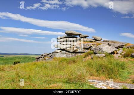 Granite tor on Stowe's Hill, Bodmin Moor, Cornwall, UK, under a spectacular summer sky. Bodmin Moor is a location in the TV series Poldark. Stock Photo