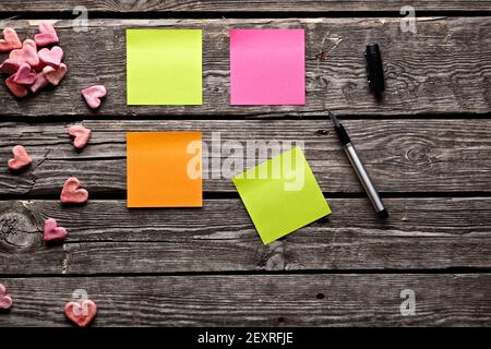 Different color sticky notes on wood table. Stock Photo