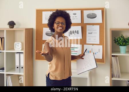 Millennial african american woman presenting project startup or financial report Stock Photo