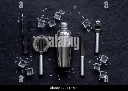 Set of cocktail drink tools and ingredients with shaker and ice. Flat lay Stock Photo