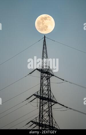 Full moon, high voltage pylon, transmission line pylon, Germany, Stock Photo