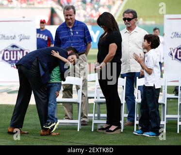 Former Texas Rangers' Michael Young, stands by his wife Cristina