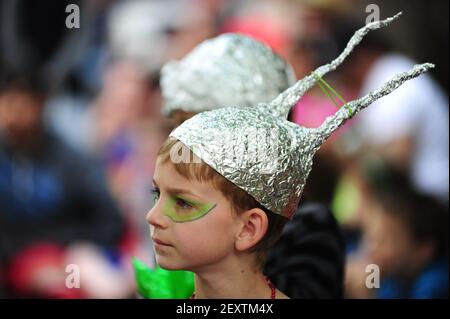A young boy wearing a tin foil hat watches as the 15th annual McMenamins UFO festival parade marches by on May 17th 2014. The event, which spans four days, honors the 1950 Trent sighting by Evelyn and Paul Trent who witnessed and photographed a disk shaped object hovering over their farm outside of McMinnville.(Photo By Alex Milan Tracy/Sipa USA)