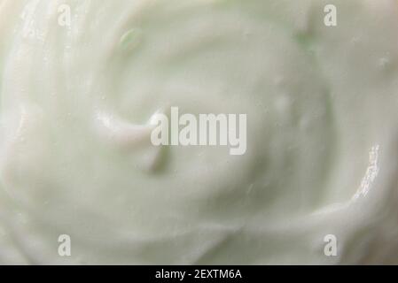 Greenish body cream texture abstract background. Horizontal composition. Stock Photo