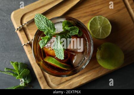 Board with glass of Cuba Libre, top view Stock Photo