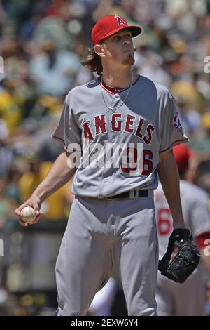 Oakland Athletics' Josh Donaldson reacts while batting while Seattle  Mariners catcher Mike Zunino picks up the ball during a baseball game in  Seattle on Saturday, Sept. 28, 2013. (AP Photo/John Froschauer Stock