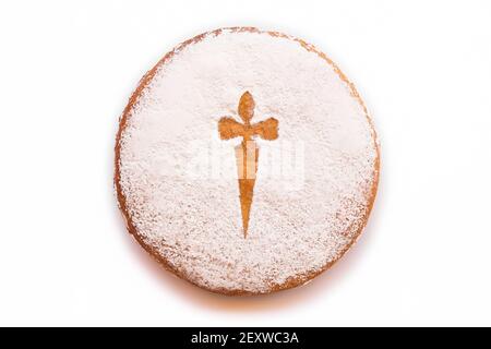 Traditional spanish cake. Tarta de Santiago isolated on white. Almond Stock Photo