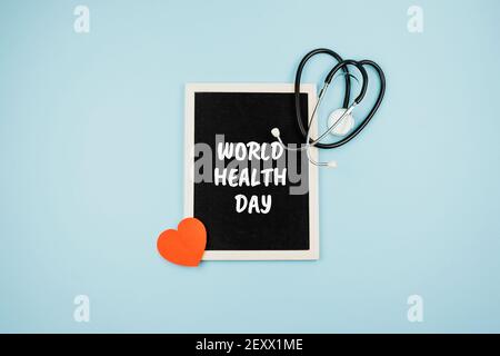 World Health Day, medical and healthcare. Stethoscope and text World Health Day in frame on blue background Stock Photo
