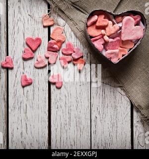 Open heart shaped gift box with heap of hearts Stock Photo