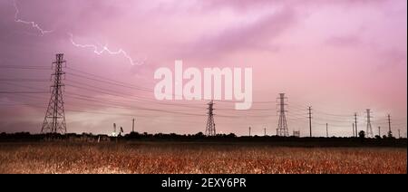 Deep South Thunderstorm Lightning Strike over Power Lines Poles Stock Photo