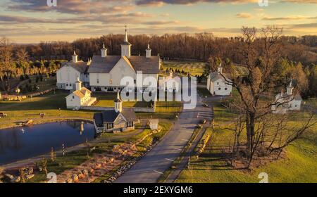 An Aerial View at Sunset of Antique Restored Barns Stock Photo