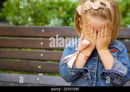 Portrait of funny little child, adorable blonde toddler girl Stock Photo