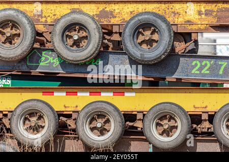 Large flatbed trailers stacked on top of one another Stock Photo