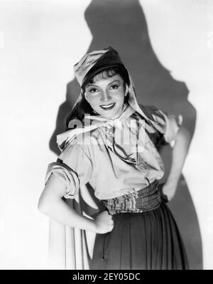 CLAUDETTE COLBERT Publicity Portrait as Cigarette in UNDER TWO FLAGS 1936 director FRANK LLOYD novel Ouida A Darryl F. Zanuck Production / 20th Century Pictures / Twentieth Century Fox Stock Photo