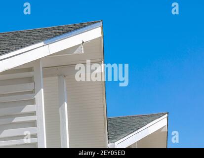 Architectural photograph of a roof against a brilliant blue sky Stock Photo