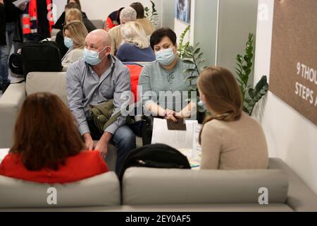 KYIV, UKRAINE - MARCH 5, 2021 - The vaccination of employees against COVID-19 takes place at the Dobrobut Medical Centre, Kyiv, capital of Ukraine. Stock Photo