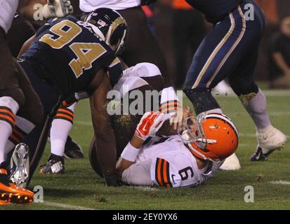 Cleveland Browns quarterback Brian Hoyer (6) is sacked by St. Louis Rams  defensive end Robert Quinn during the second quarter of preseason action at  FirstEnergy Stadium in Cleveland on Saturday, Aug. 23