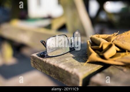 Glasses and gloves from a construction worker Stock Photo