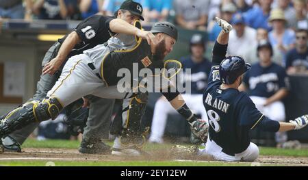 Pittsburgh Pirates' Russell Martin (55) gets a facefull of cream in  celebration from Pittsburgh Pirates' A.J. Burnett after Martin drove in  Gaby Sanchez with the game winning hit in the fourteenth inning