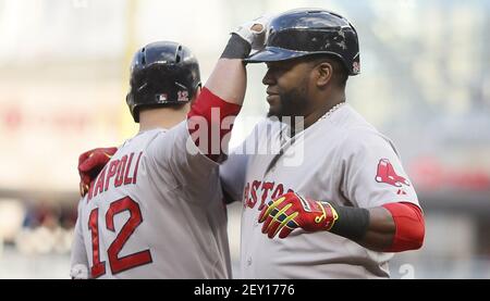 Shirtless Mike Napoli celebrates with helmeted Jonny Gomes 