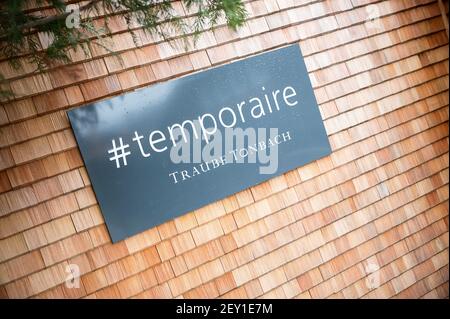 Baiersbronn, Germany. 05th Mar, 2021. '#temporaire' is written on a sign at the Traube Tonbach's interim restaurant 'temporaire - Schwarzwaldstube'. The hotel's restaurants have been given back their stars, which they lost after a fire in the main building in January 2020. Credit: Sebastian Gollnow/dpa/Alamy Live News Stock Photo