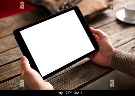 Digital tablet in male hands over background Stock Photo