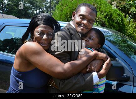 Tracey O Neal right and her sister Michelle Wallace hug their