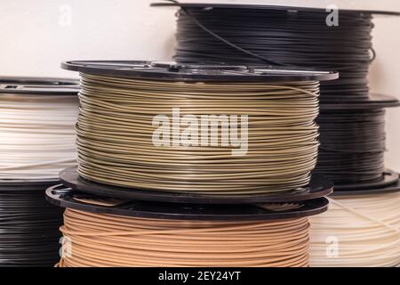 Many spools of plastic filament for 3D printer. Stock Photo