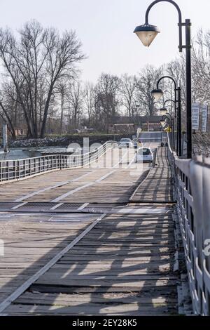 wooden lane at pontoon bridge on Ticino river, shot on bright winter day at Bereguardo, Pavia, Lombardy, Italy Stock Photo