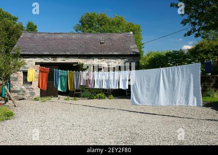 Household washing hanging out to dry in sunshine. Stock Photo