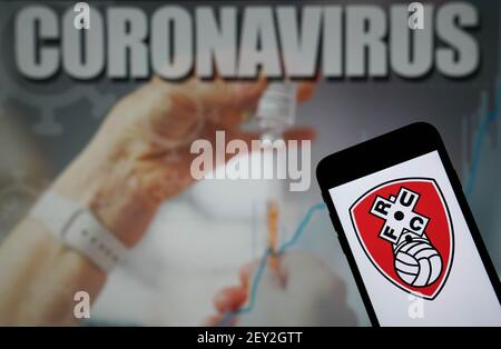 File photo dated 09-01-2021 of The Rotherham United Football Club logo seen displayed on a mobile phone with a Coronavirus illustration on a monitor in the background. Issue date: Friday March 5, 2021. Stock Photo