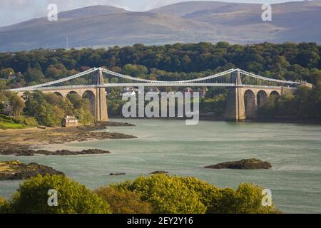 The Menai suspension bridge connecting the mainland with the island of Anglesey Wales designed by Thomas Telford and completed in 1826 Stock Photo