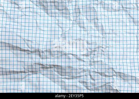 Background, texture of a crumpled notebook sheet with grid-like markings Stock Photo