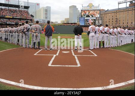 Baltimore Orioles players stand for the National Anthem of Canada and the  United States prior to the start of the Toronto Blue Jays at Baltimore Orioles  spring training baseball game at Ed
