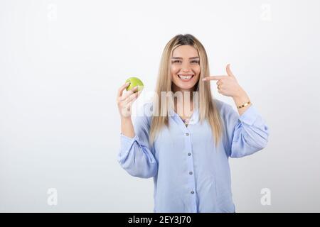 Portrait photo of a pretty attractive woman model standing and holding Stock Photo