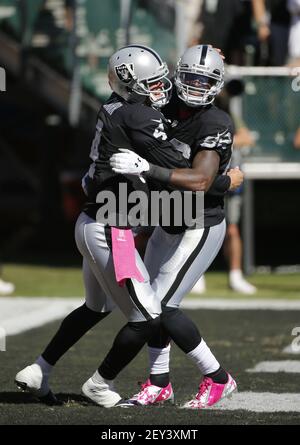 Oakland Raiders wide receiver James Jones tries to make a catch while being  covered by Green Bay Packers cornerback Demetri Goodson during an NFL  pre-season football game Friday Aug. 22, 2014, in