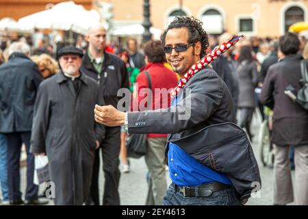 a street artist, a mime, performs in the square among the people. Italy, Europe Stock Photo