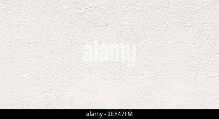 Panorama blank concrete white rough wall for background. Beautiful white cement wall plastered surface background pattern. Stock Photo