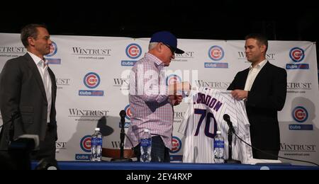 President Jed Hoyer of the Chicago Cubs presents a jersey to