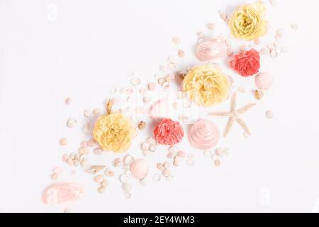 Composition of flowers, frame from rose flowers and seashells, starfish on a white background. Flat lay, top view, Stock Photo