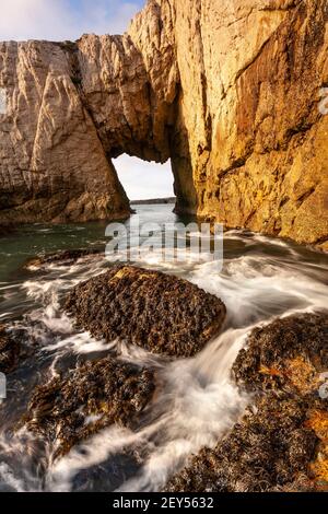 Bwa Gwyn sea arch near Rhoscolyn, Anglesey, North Wales Stock Photo